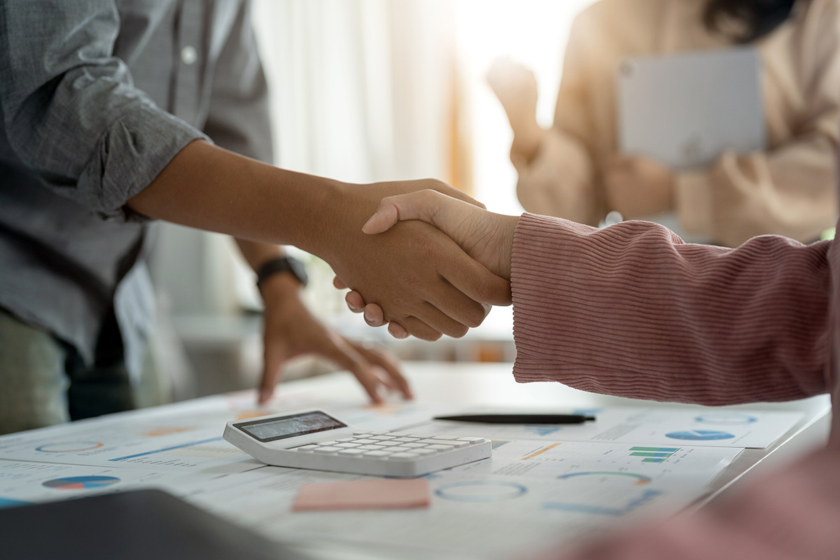 image of two people shaking hands